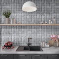 Gray matte porcelain 2x2 inch square mosaic tile backsplash with uniform pattern