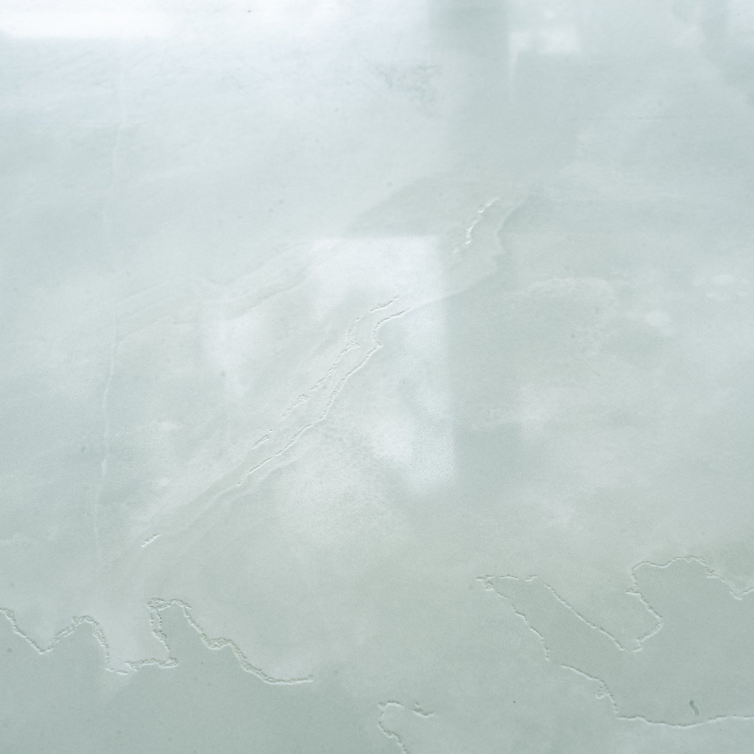 Soft jade green honed porcelain large tile with subtle natural veins 24x48 inches