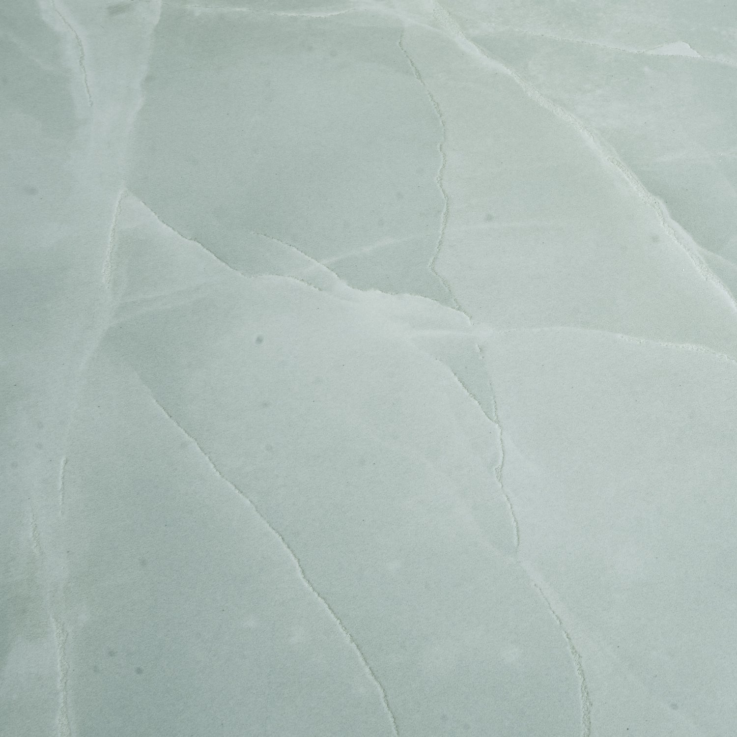 soft jade green honed porcelain large tile with subtle natural stone texture 24x48 inches