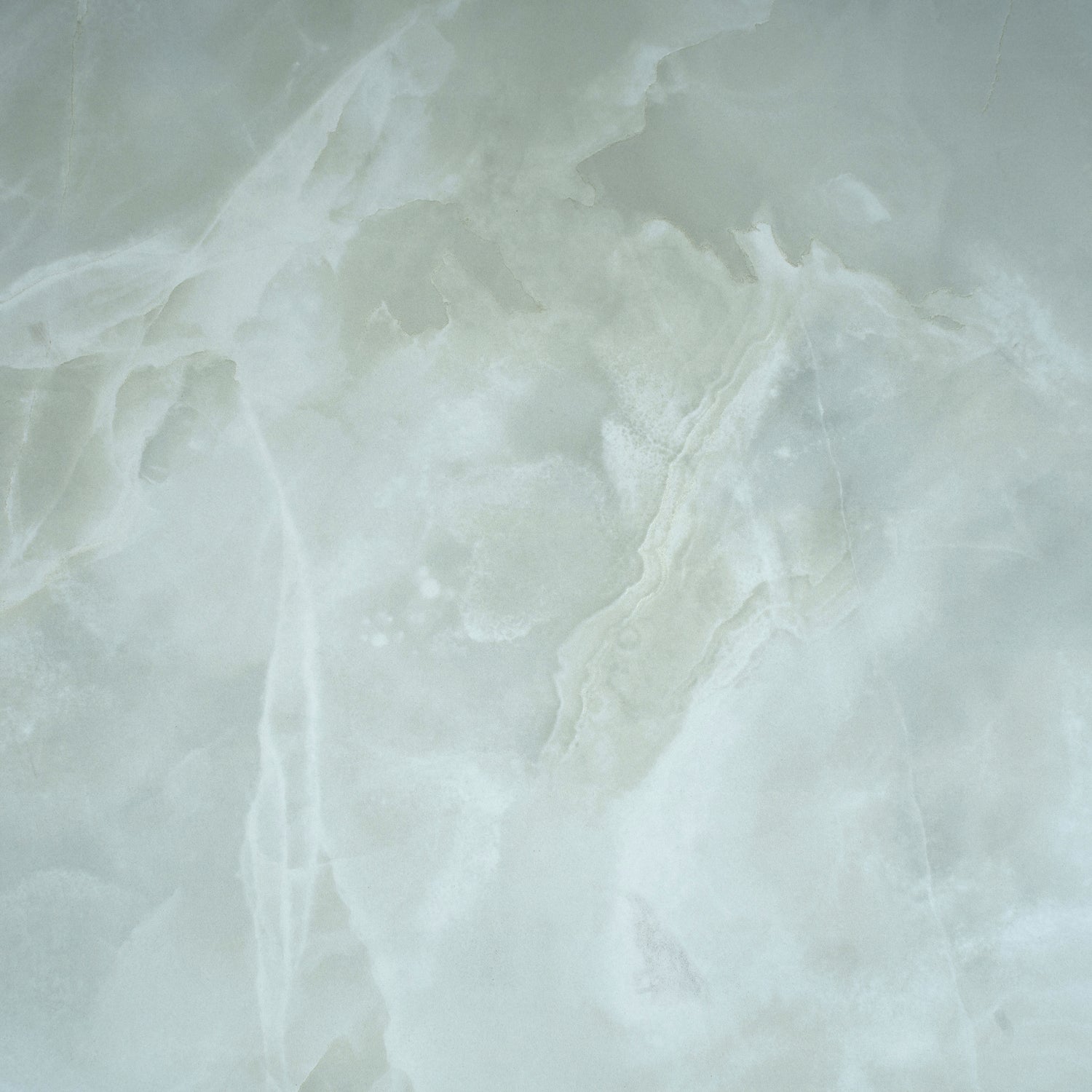 Soft jade green honed porcelain large tile with subtle natural stone texture and veining