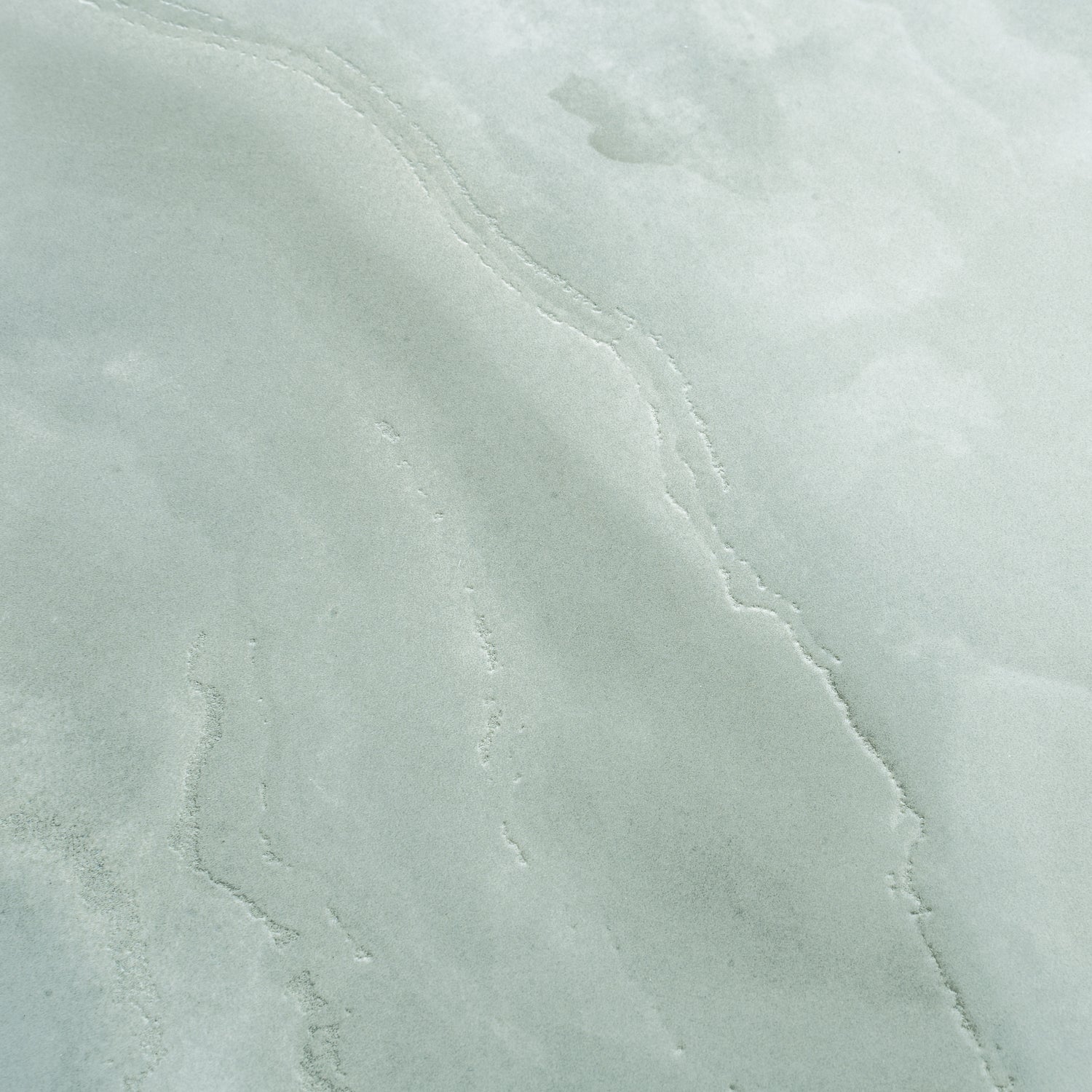Soft jade green 24x48 honed porcelain large tile with subtle textured veining