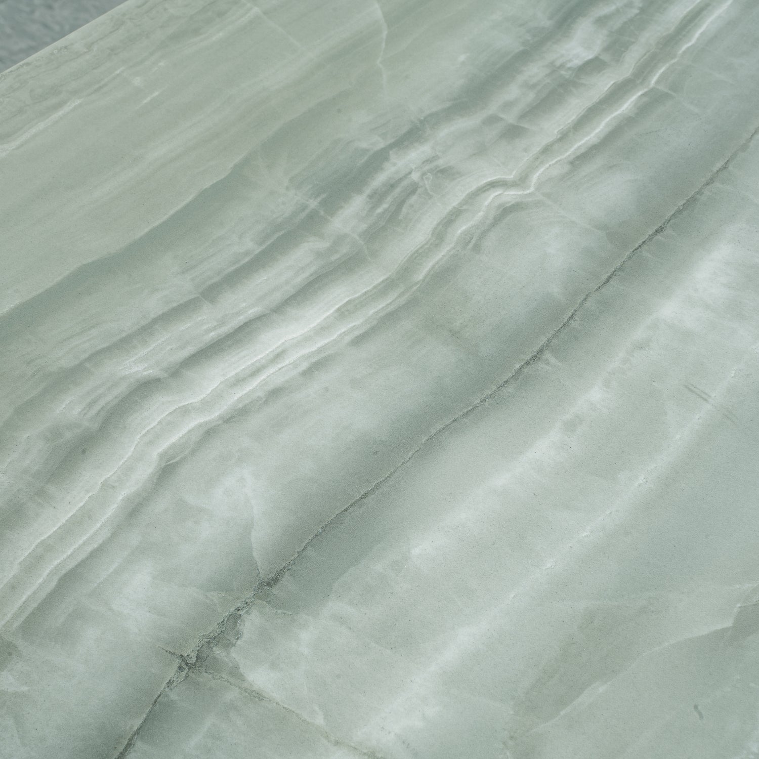 Sage jade green 24x48 honed porcelain tile with natural veining and smooth finish