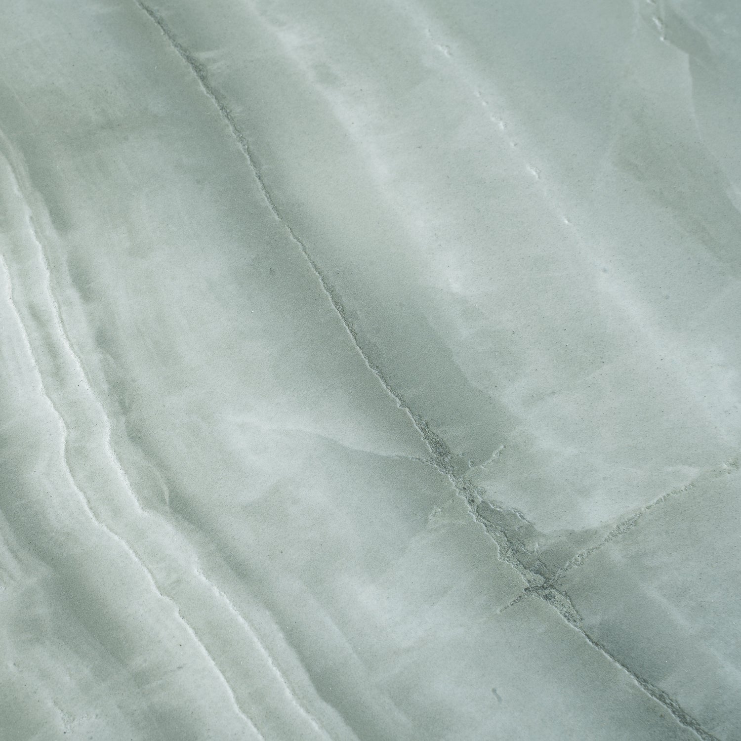 Sage jade green 24x48 honed porcelain large tile with subtle natural veining in green tones