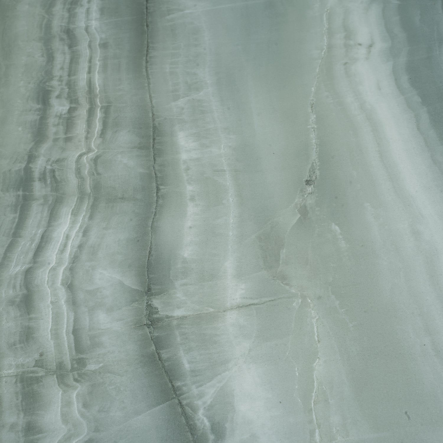 Sage jade green 24x48 honed porcelain tile with subtle veining and smooth finish