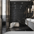 Black polished porcelain large format tile with white veining on bathroom wall and floor