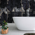 Black lappato porcelain large format tile 24x48 installed on bathroom wall