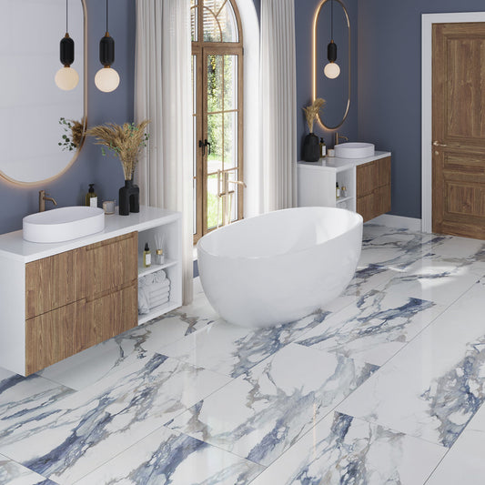 Air Superiority Blue polished porcelain large format 24x48 floor tile with marble-like veining in bathroom setting