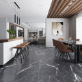 Matte 24x48 porcelain tiles in charcoal black with white veining, installed in a modern dining area with fewer grout lines on floor