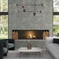 Blue green ceramic dotted large format tiles with matte finish installed on a fireplace wall