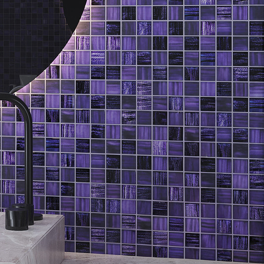 Purple 11x11 inch square glass mosaic tile with glossy matte finish on a backsplash