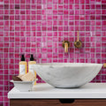 Fuchsia pink 11x11 square glass mosaic tile with glossy matte finish on bathroom wall