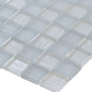close-up of glossy and matte gray square glass mosaic tiles 11x11 arranged in a grid