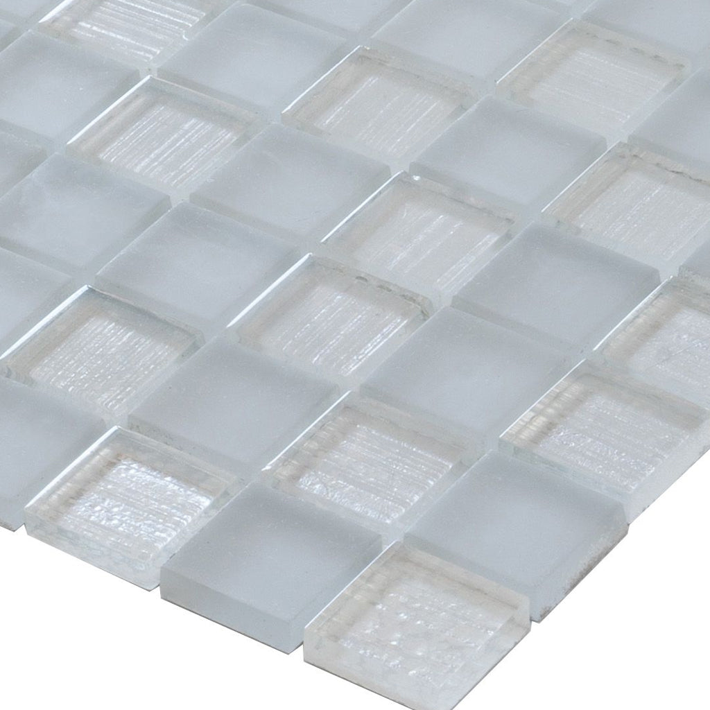 close-up of glossy and matte gray square glass mosaic tiles 11x11 arranged in a grid