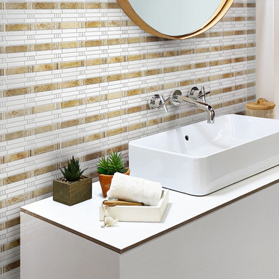 Beige and white polished travertine marble mosaic tile in a linear pattern on bathroom wall
