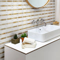 Beige and white polished travertine marble mosaic tile in a linear pattern on bathroom wall