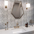 Flint gray polished Bardiglio Nuvolato and Bianco Carrara marble chevron mosaic tile on bathroom wall