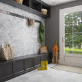 White honed Bianco Carrara marble hexagon tile floor and wall in mudroom space