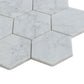 White honed marble hexagon mosaic tiles with subtle grey veining in 10x11 inch size