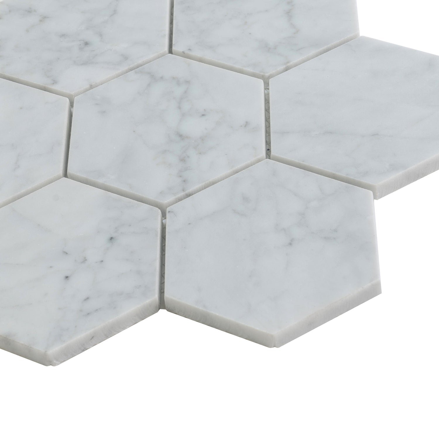 White honed marble hexagon mosaic tiles with subtle grey veining in 10x11 inch size