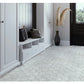 white honed marble hexagon mosaic tile flooring in modern entryway