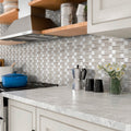 Polished 12x12 white and beige marble mosaic tile backsplash with brick pattern in a kitchen