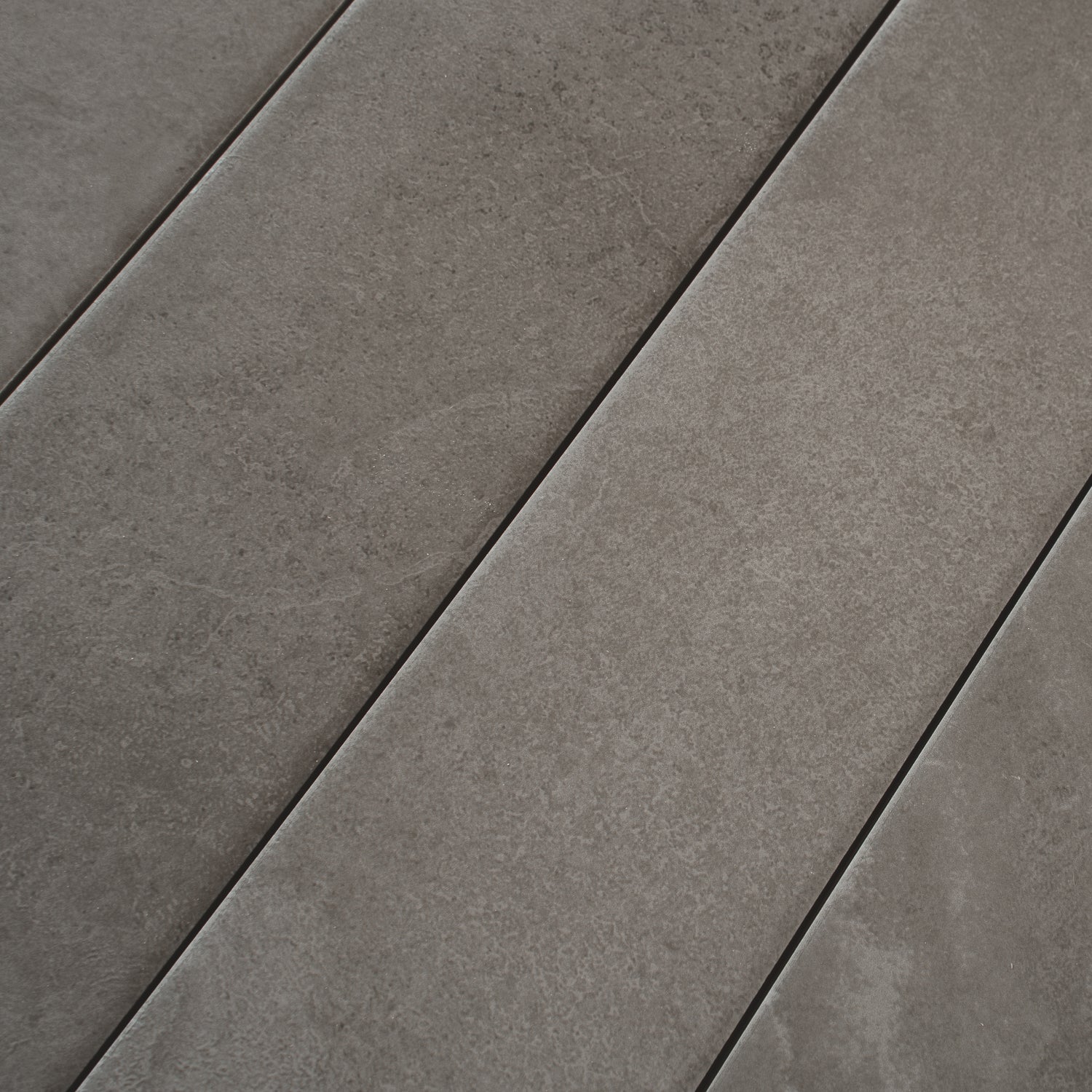 Charcoal gray 3x24 matte porcelain plank tile with subtle texture and smooth finish
