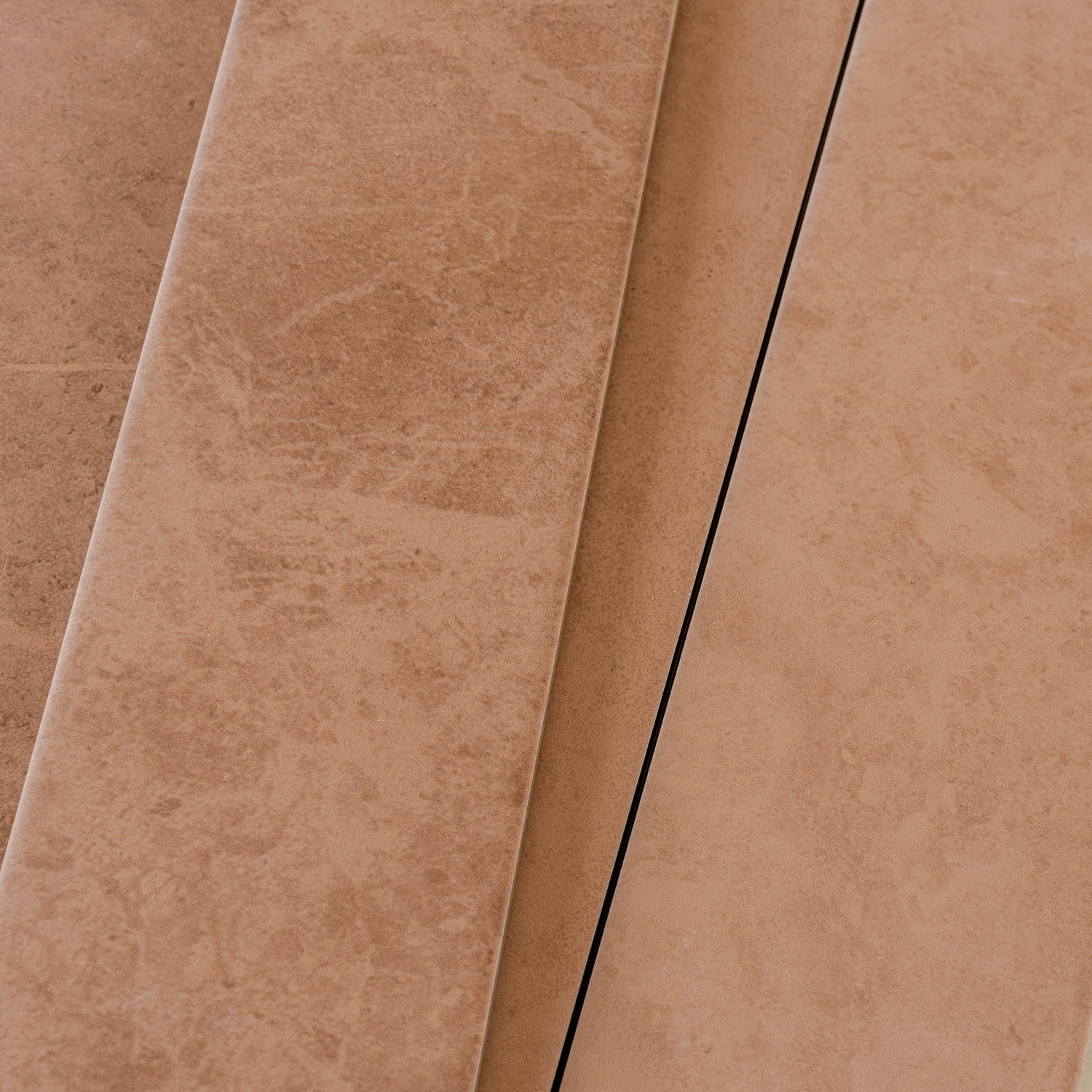 Sunbaked terracotta matte porcelain plank tiles 3x24 inches with textured natural terracotta finish