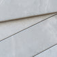soft grey 3x24 matte porcelain plank tile with subtle texture and natural stone pattern