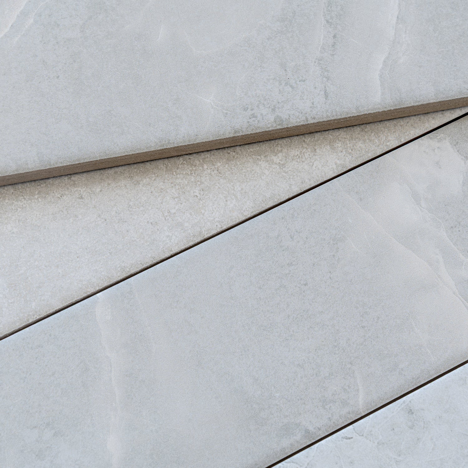 soft grey 3x24 matte porcelain plank tile with subtle texture and natural stone pattern
