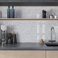 Polished chevron marble mosaic tile in white, gray, and blue hues for kitchen backsplash or wall