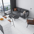 White Thassos honed hexagon marble tile installed on a living room floor