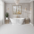 White Thassos honed marble hexagon mosaic tile floor in bathroom
