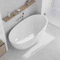 White Thassos marble penny round mosaic tile with honed finish on bathroom floor and wall