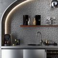 Polished pebble-shaped gray metal mosaic tile on kitchen backsplash