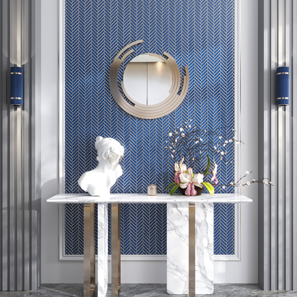 Glossy glass accent wall mosaic tile in a blue and gray herringbone pattern