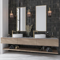 Black glossy ceramic 2.5x8 subway tiles on bathroom wall backsplash