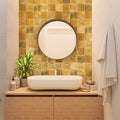 Honey orange glossy 4x4 ceramic square tiles installed on bathroom wall