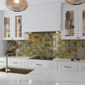 Glossy olive green 4x4 square ceramic tile backsplash in kitchen setting