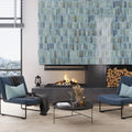 Blue glossy ceramic subway tiles 2.5x8 inches on fireplace wall