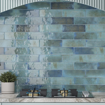 Blue glossy ceramic subway tile, 2.5x8 inches, installed as a kitchen backsplash tile