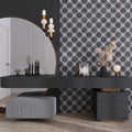 Black matte ceramic 5x5 inch cross patterned tile on interior wall surface