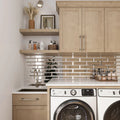 Clear silver polished glass subway tiles, 3x12 inch, installed as a kitchen backsplash