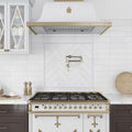 White honed Thassos marble rectangular pencil trim tiles on kitchen backsplash