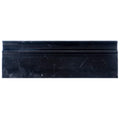 Polished black marble baseboard tile trim with subtle white veining and decorative ridge accents