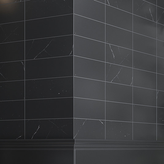 Polished black 4x12 marble subway tiles with subtle veining on interior corner wall surface