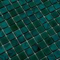 Glossy dark green 12x12 square glass mosaic tiles with subtle marbled pattern and white grout