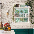 White beige matte recycled glass herringbone mosaic tile installed on kitchen backsplash and walls