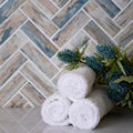 Beige matte recycled glass herringbone mosaic tile on wall, 11x13 inches