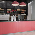 Red glossy porcelain penny round mosaic tile backsplash on kitchen counter front panel