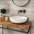 Beige matte porcelain rectangular tiles installed on bathroom wall and backsplash surface